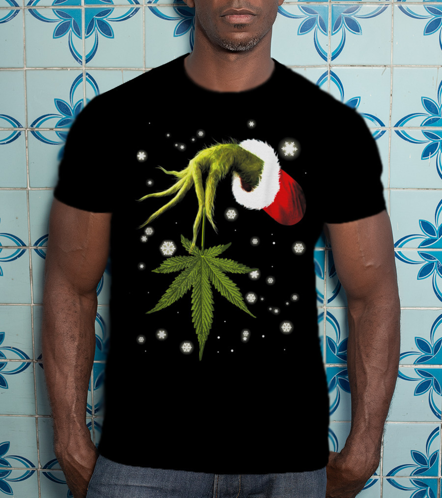 Grinch Hand Holding Cannabis Leaf With Santa Hat And Snowflakes T-Shirt