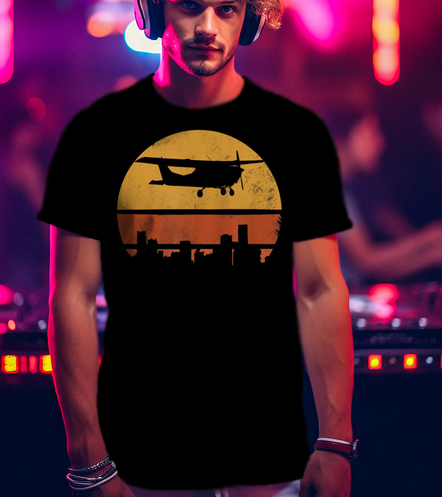 Retro Pilot C172 Flying Silhouette Over Sunset Cityscape T-Shirt