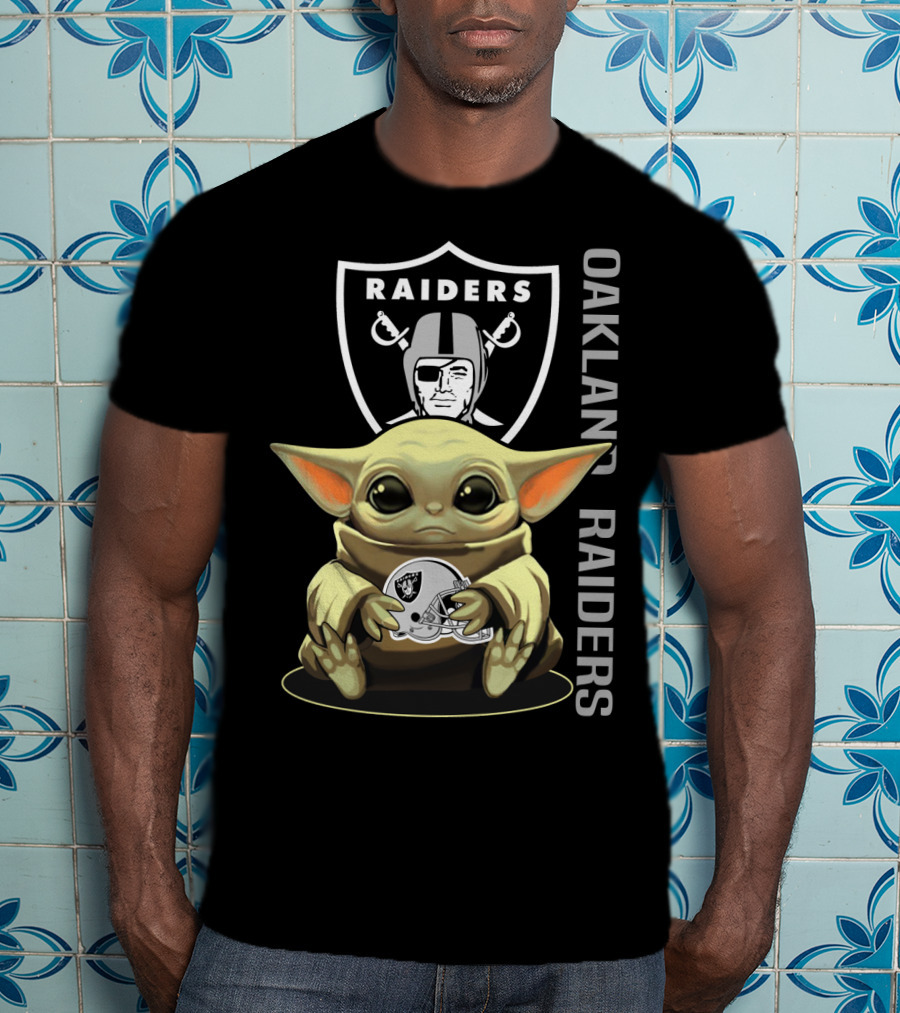 Baby Yoda Holding Oakland Raiders Helmet With Raiders Logo In Background T-Shirt