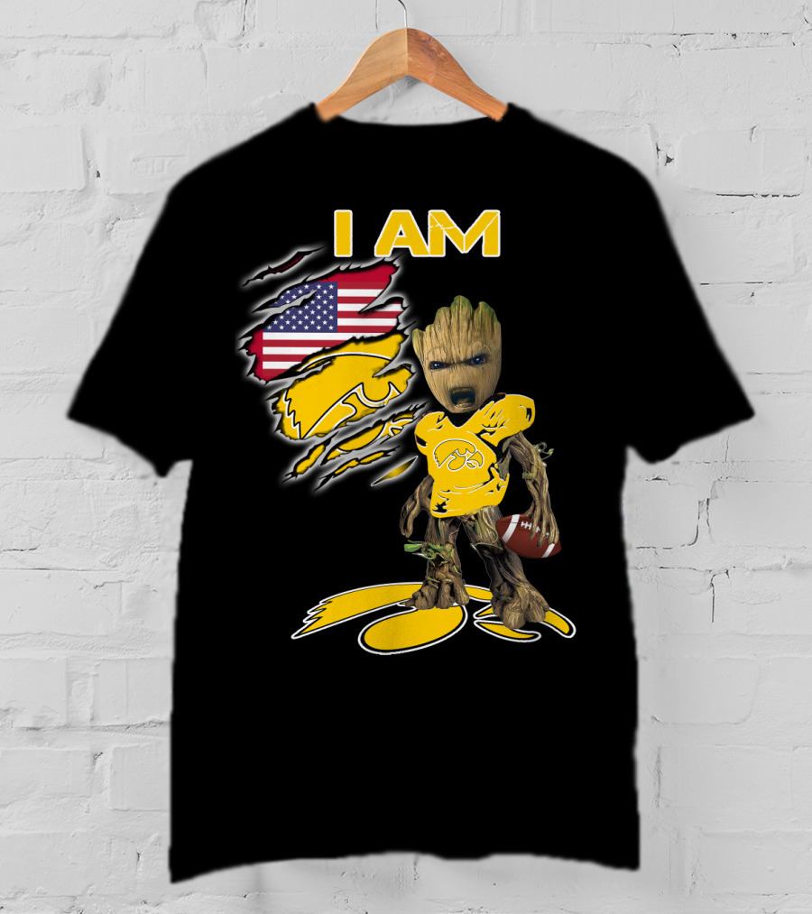 I Am Hawkeyes Baby Groot Holding Football With Usa Flag And Iowa Hawkeyes T-Shirt
