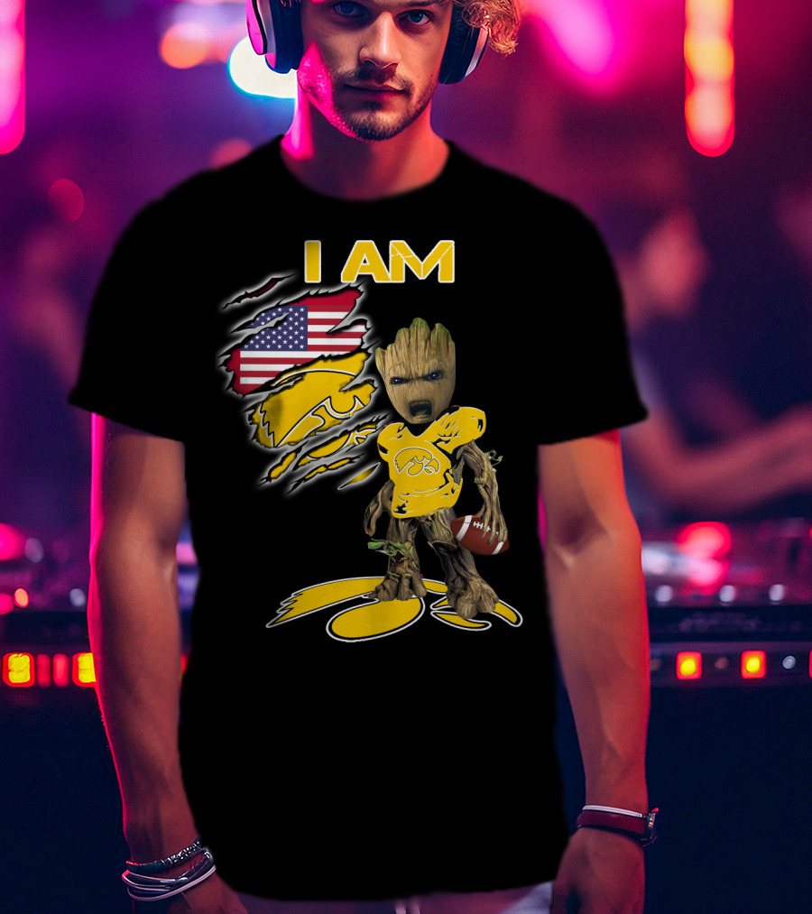I Am Hawkeyes Baby Groot Holding Football With Usa Flag And Iowa Hawkeyes T-Shirt
