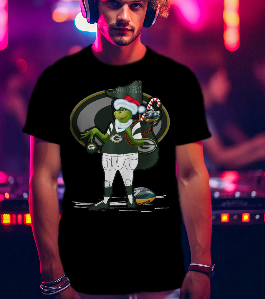 Grinchxmas Green Bay Packers Santa Hat Grinch Holding Helmet And Candy Cane T-Shirt