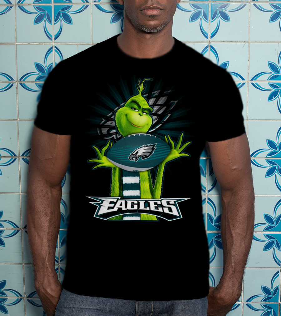 Grinch Holding Philadelphia Eagles Football With Team T-Shirt