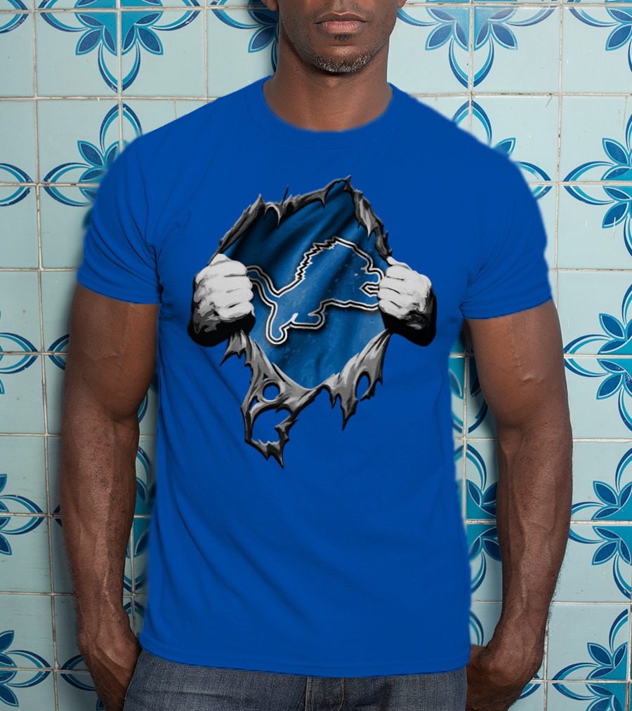 Torn Skin Revealing Detroit Lions Emblem On Blue T-Shirt