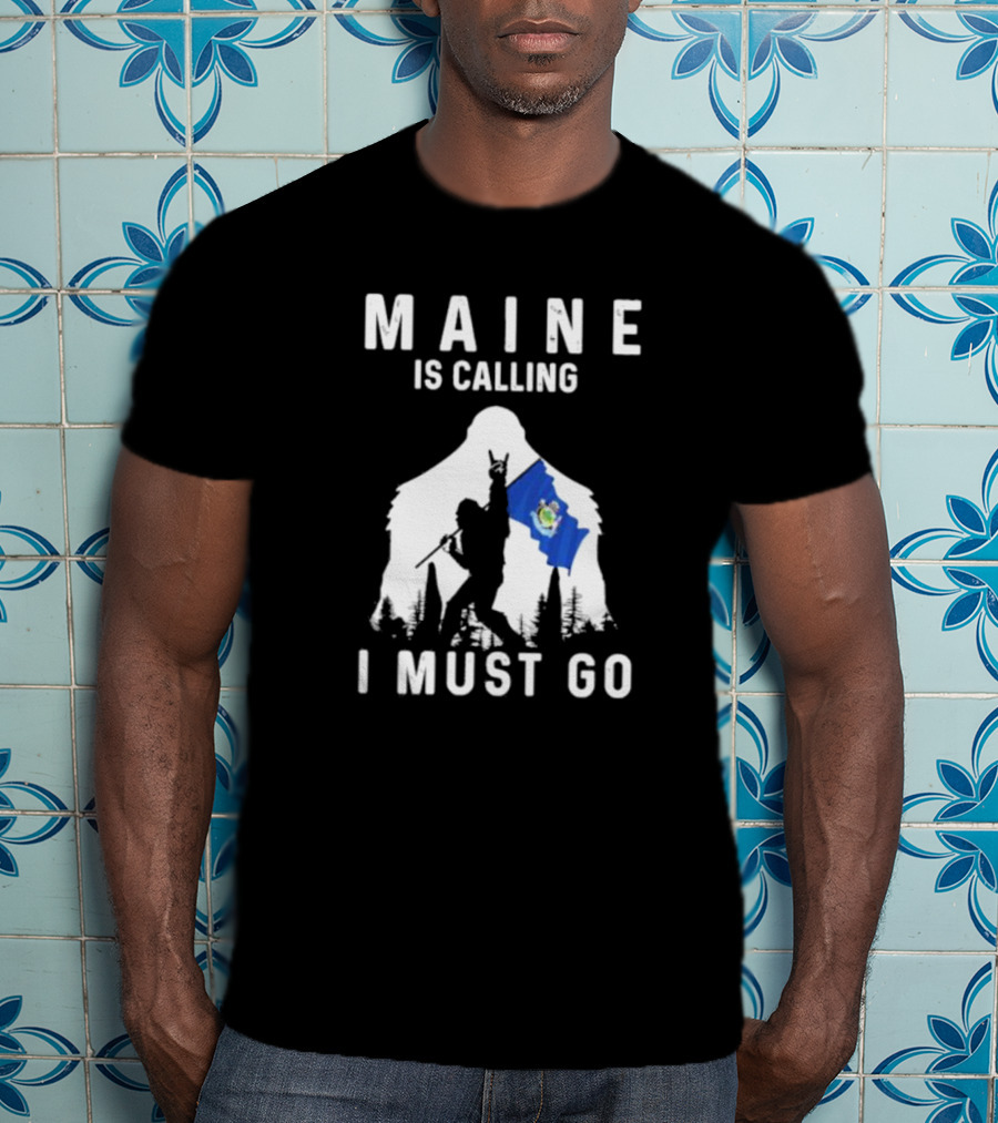 Maine Is Calling I Must Go Bigfoot Holding Maine Flag T-Shirt