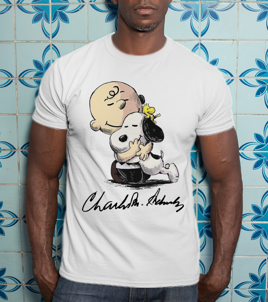 Snoopy And Charlie Brown Hugging By Charles M. Schulz T-Shirt