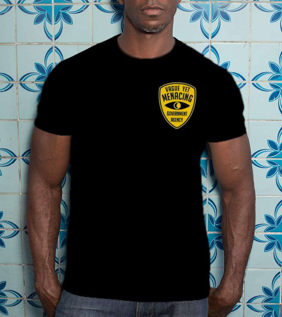 Vague Yet Menacing Government Agency Yellow Badge With Eye T-Shirt