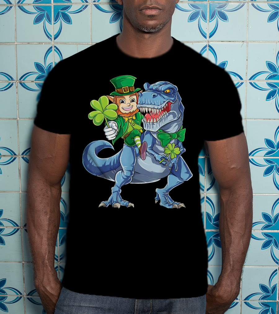 Leprechaun With Shamrock And Bowtie Riding T-Rex Dinosaur T-Shirt