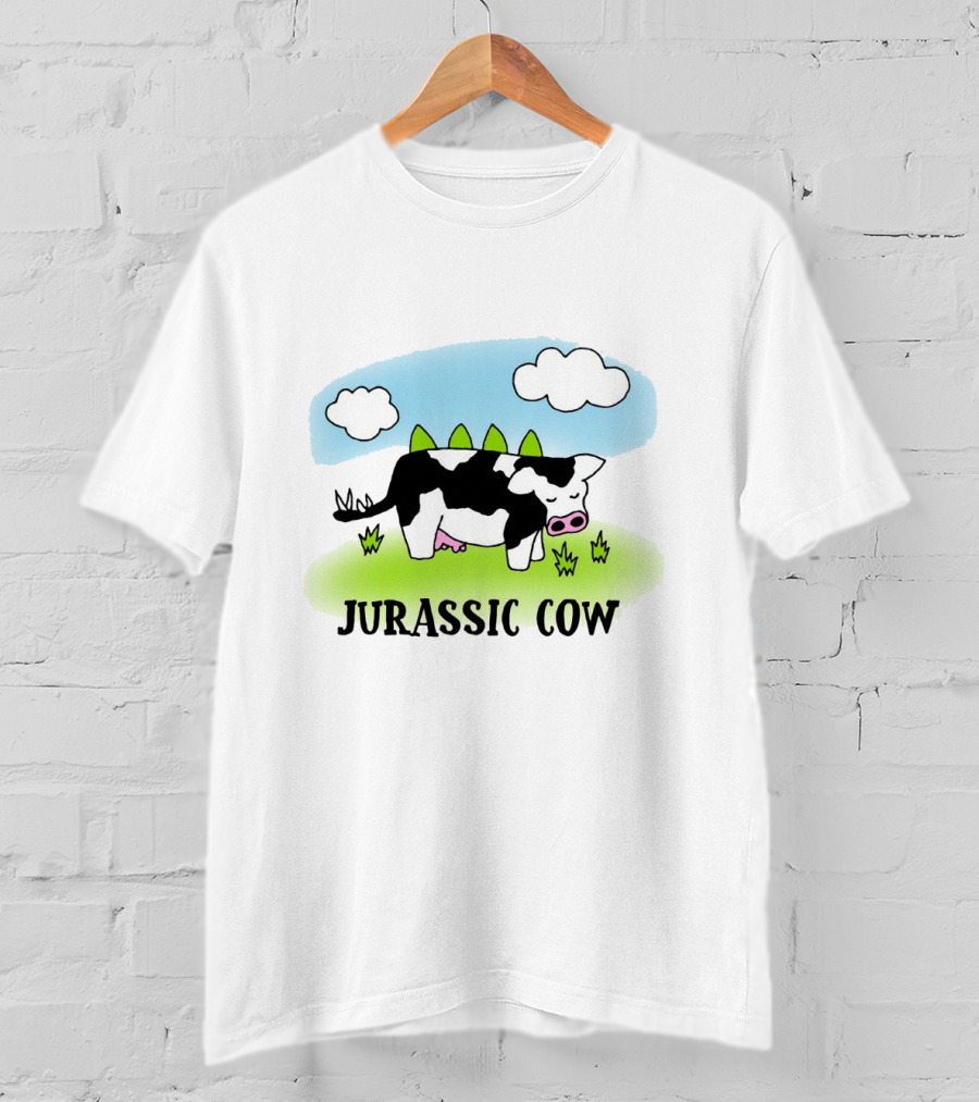Jurassic Cow Grazing With Dinosaur Spikes Under Blue Sky And Clouds In Cartoon T-Shirt
