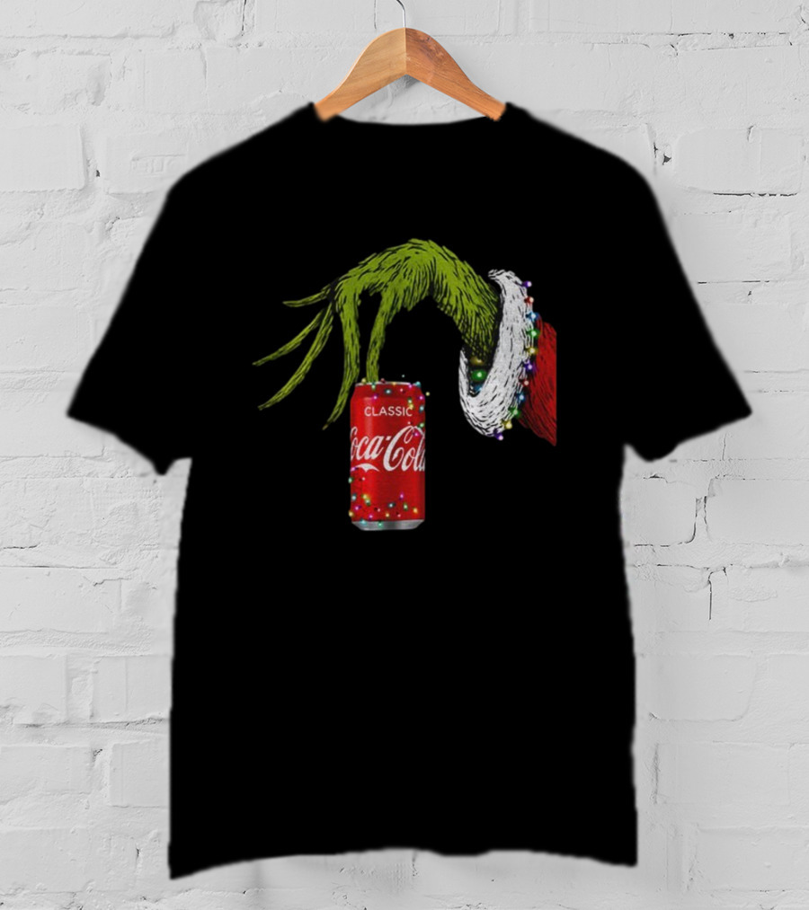 Grinch Hand Holding Coca-Cola Can Wrapped In Christmas Lights Merry Christmas T-Shirt