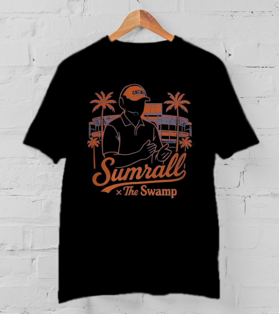 Sumrall The Swamp Coach Illustration With Palm Trees And Building Background T-Shirt