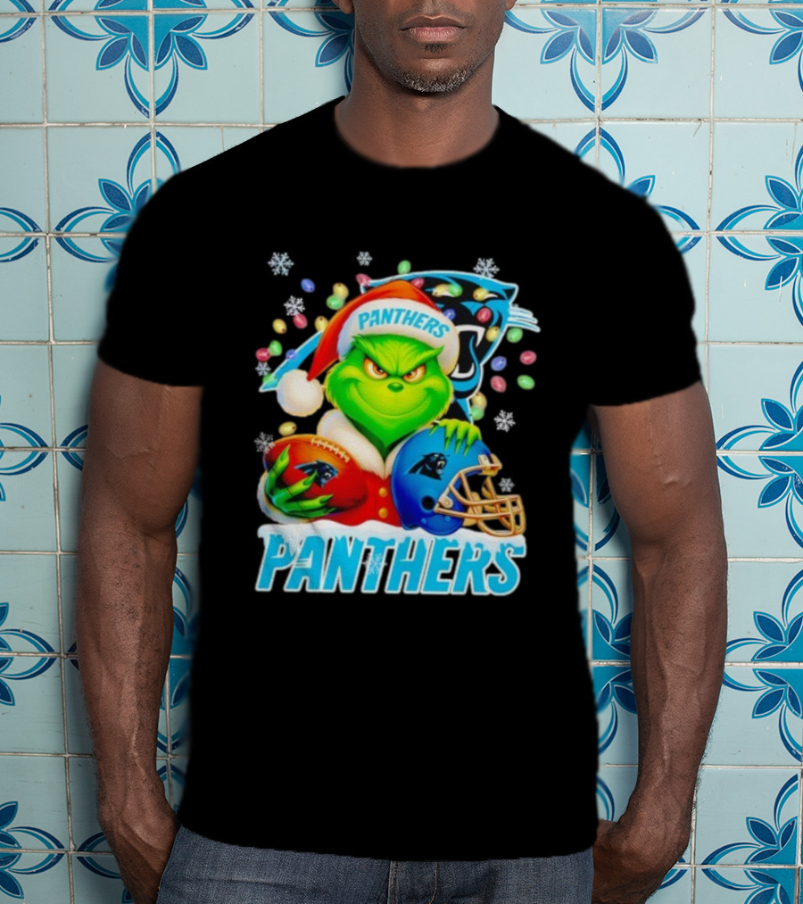 Grinch Santa Hat Holding Carolina Panthers Football And Helmet Merry Christmas T-Shirt