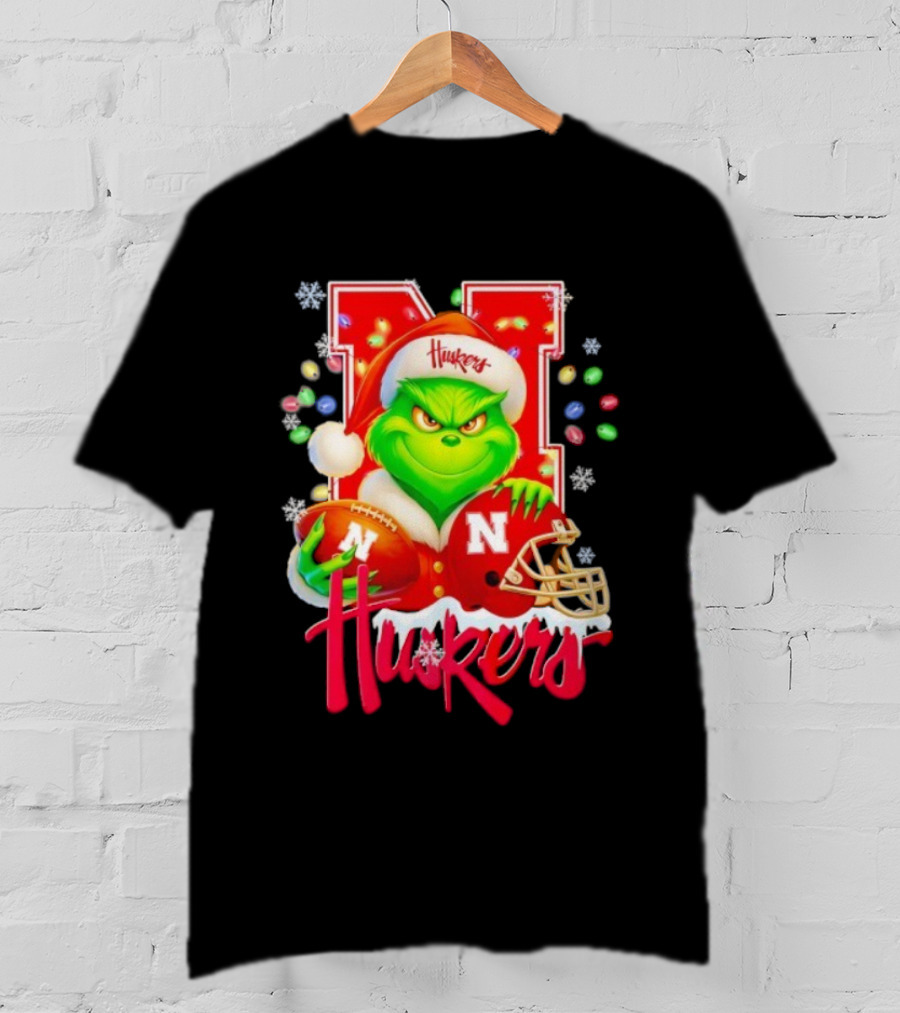 Grinch Santa With Nebraska Cornhuskers Helmet And Football Merry Christmas Huskers T-Shirt