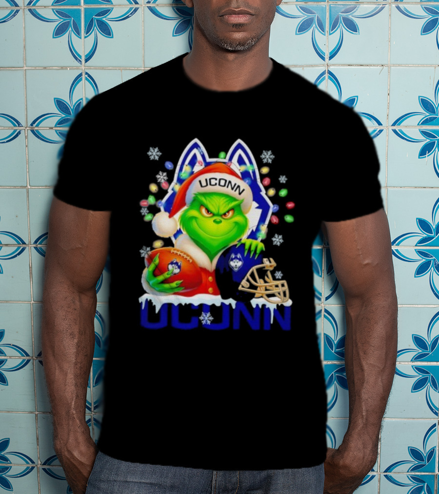 Grinch Wearing Santa Hat With UConn Huskies Football And Helmet Merry Christmas T-Shirt