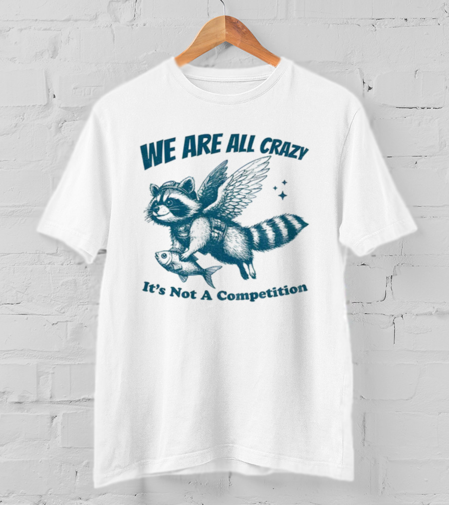 Raccoon With Wings Holding Fish We Are All Crazy It's Not A Competition T-Shirt