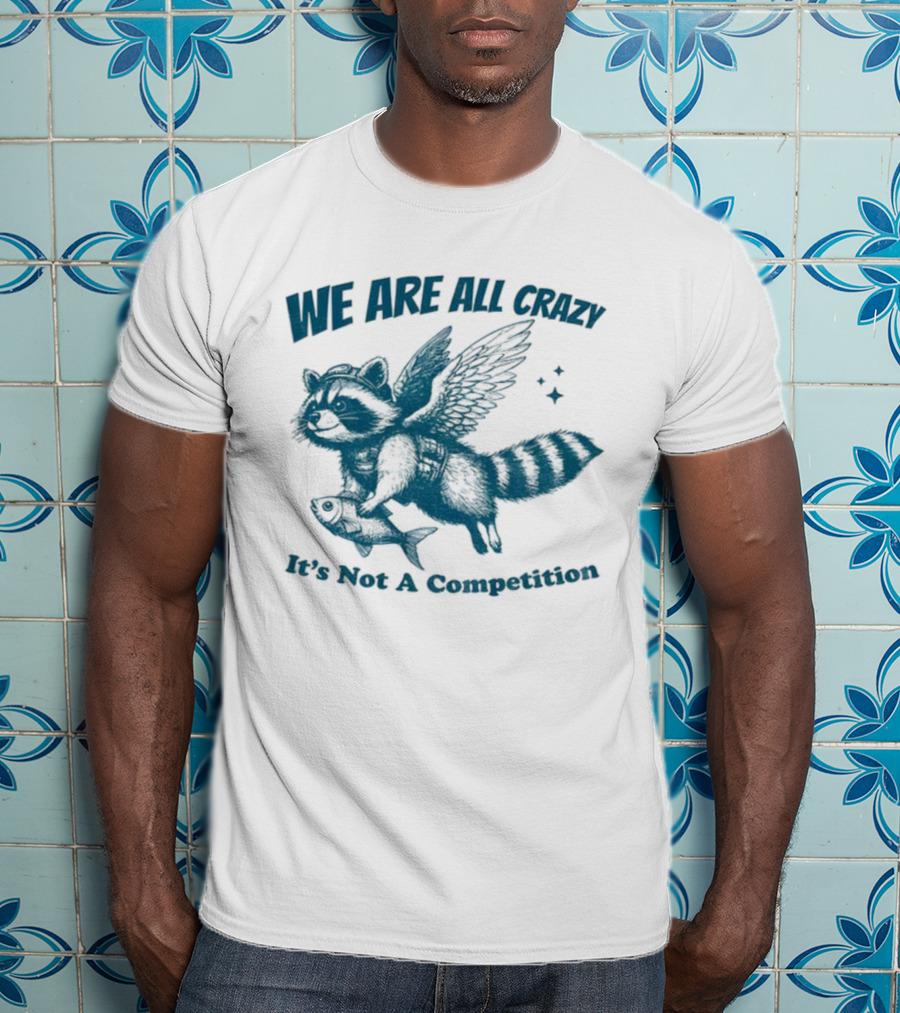 Raccoon With Wings Holding Fish We Are All Crazy It's Not A Competition T-Shirt