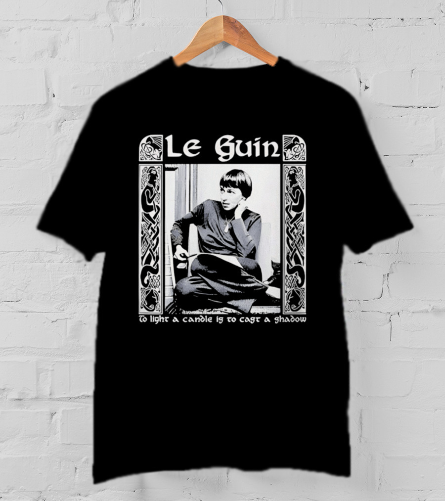 Le Guin To Light A Candle Is To Cast A Shadow T-Shirt