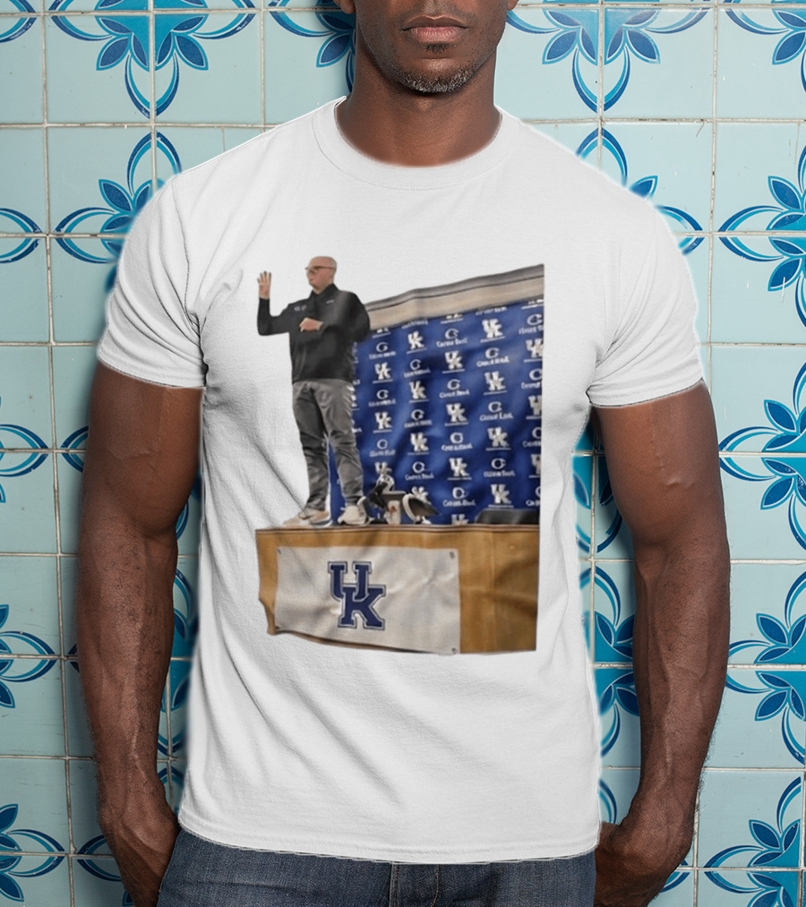 UK Volleyball Coach Craig Skinner Standing On Table With UK Logo And Awards T-Shirt