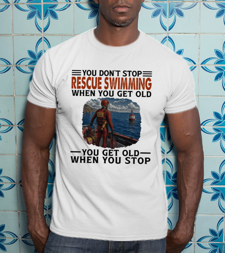 You Don't Stop Rescue Swimming When You Get Old You Get Old When You Stop Rescue Swimmer Standing On Boat Near Lighthouse T-Shirt