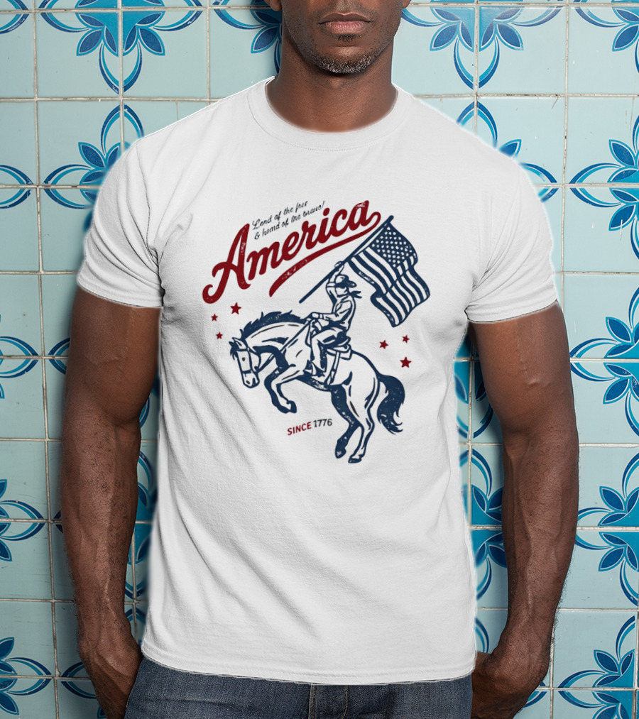 America Land Of The Free Home Of The Brave Since 1776 Cowboy Holding Flag Patriotic T-Shirt