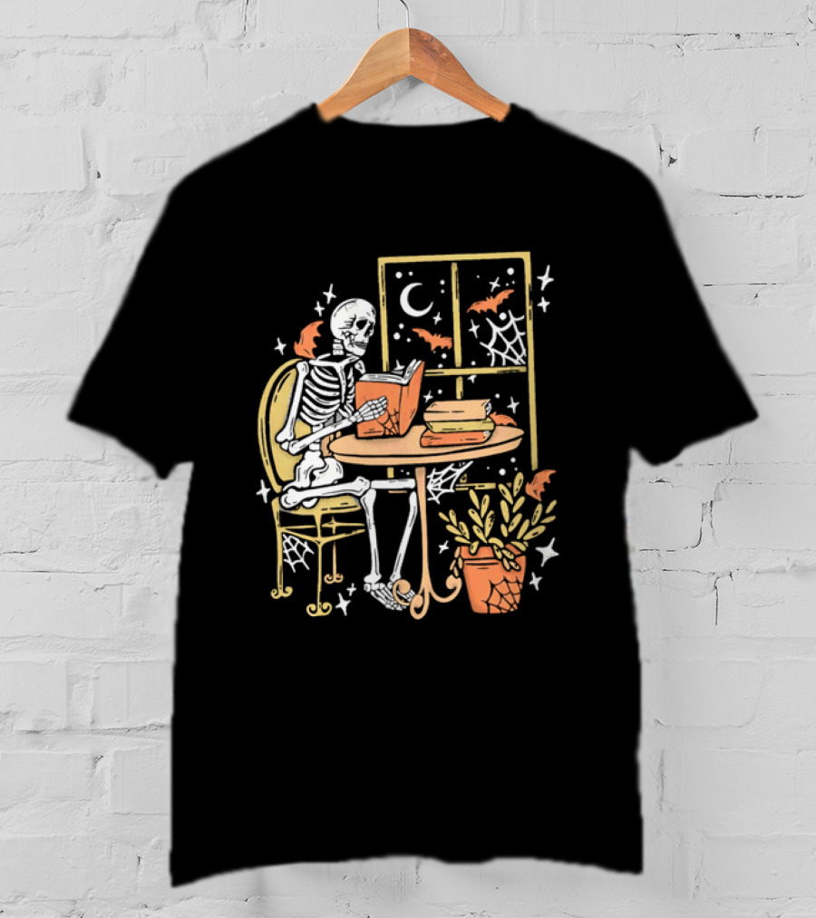 Cartoon Skeleton Reading Under Crescent Moon With Bats Orange Book Table Window T-Shirt