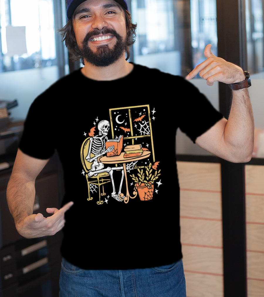 Cartoon Skeleton Reading Under Crescent Moon With Bats Orange Book Table Window T-Shirt
