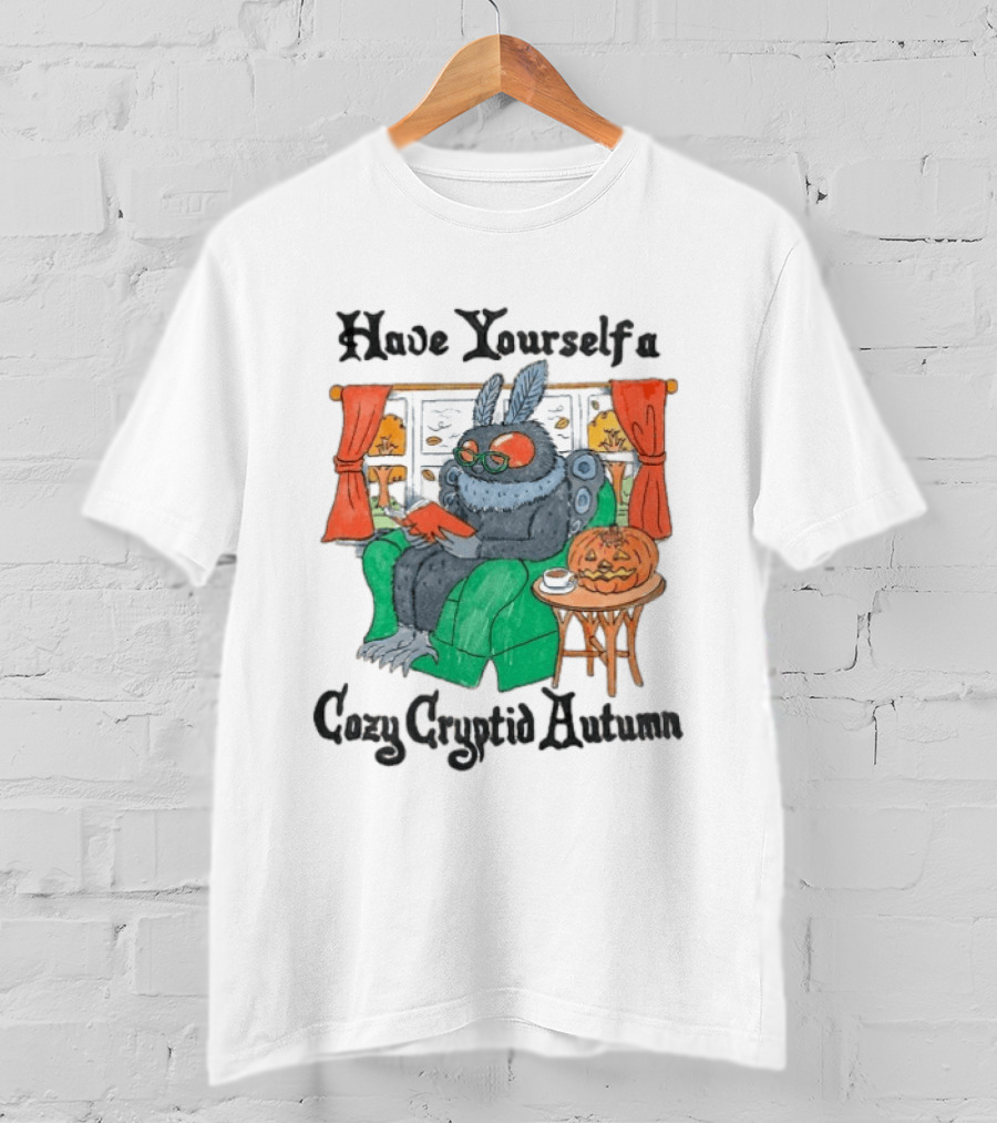 Have Yourself A Cozy Cryptid Autumn Mothman Reading By Pumpkin Window Scene T-Shirt