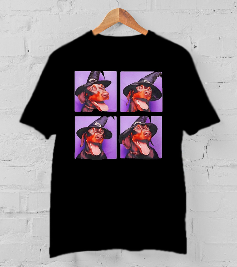 Doberman Pinscher In Witch Hat For Halloween With Purple T-Shirt