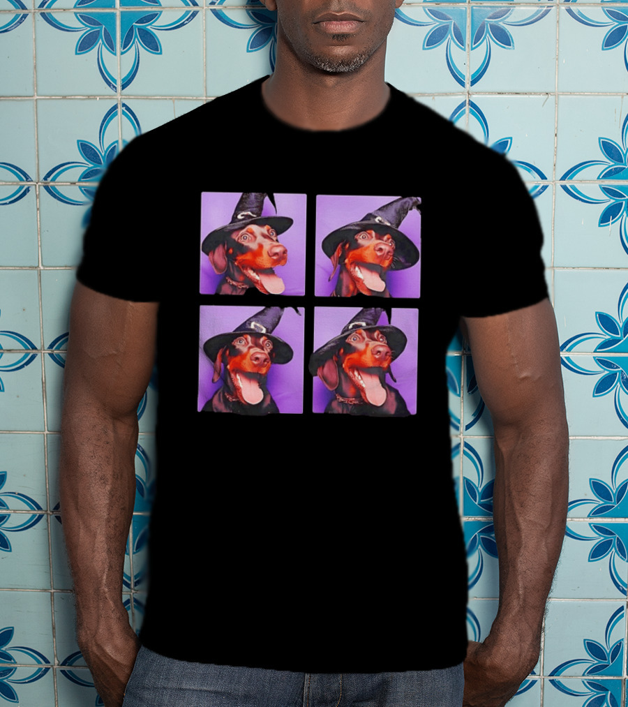 Doberman Pinscher In Witch Hat For Halloween With Purple T-Shirt