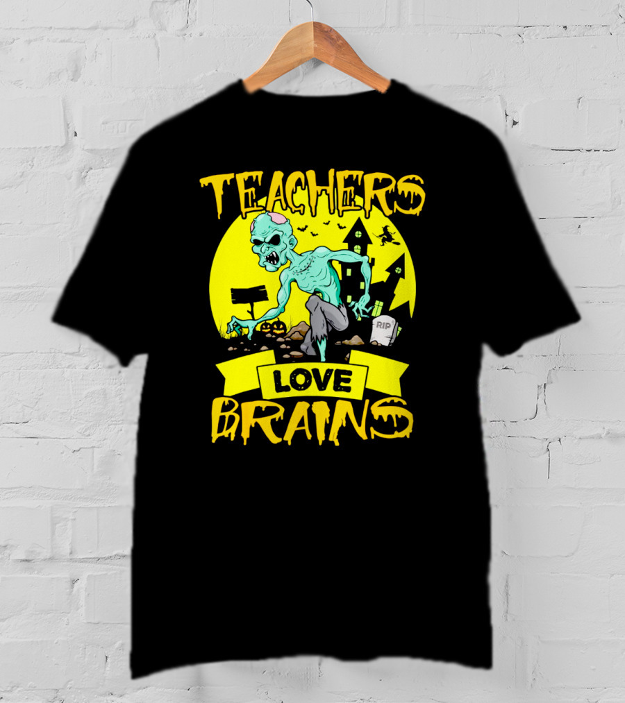 Teachers Love Brains Zombie Halloween Theme With Haunted Houses And Graveyard Background T-Shirt