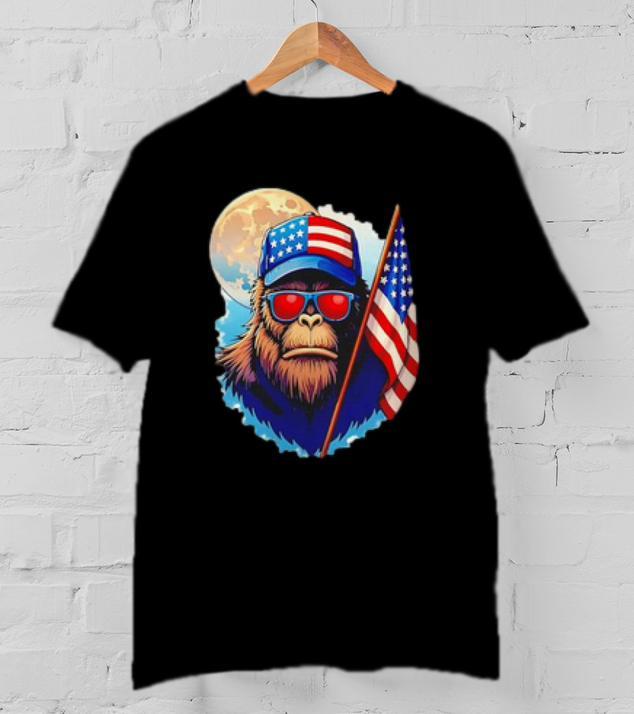 Bigfoot USA Flag Hat Sunglasses Patriotic Moon Background T-Shirt