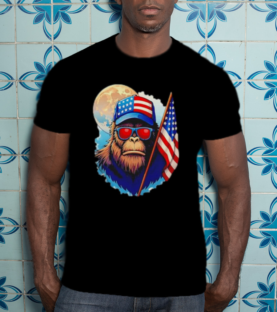 Bigfoot USA Flag Hat Sunglasses Patriotic Moon Background T-Shirt