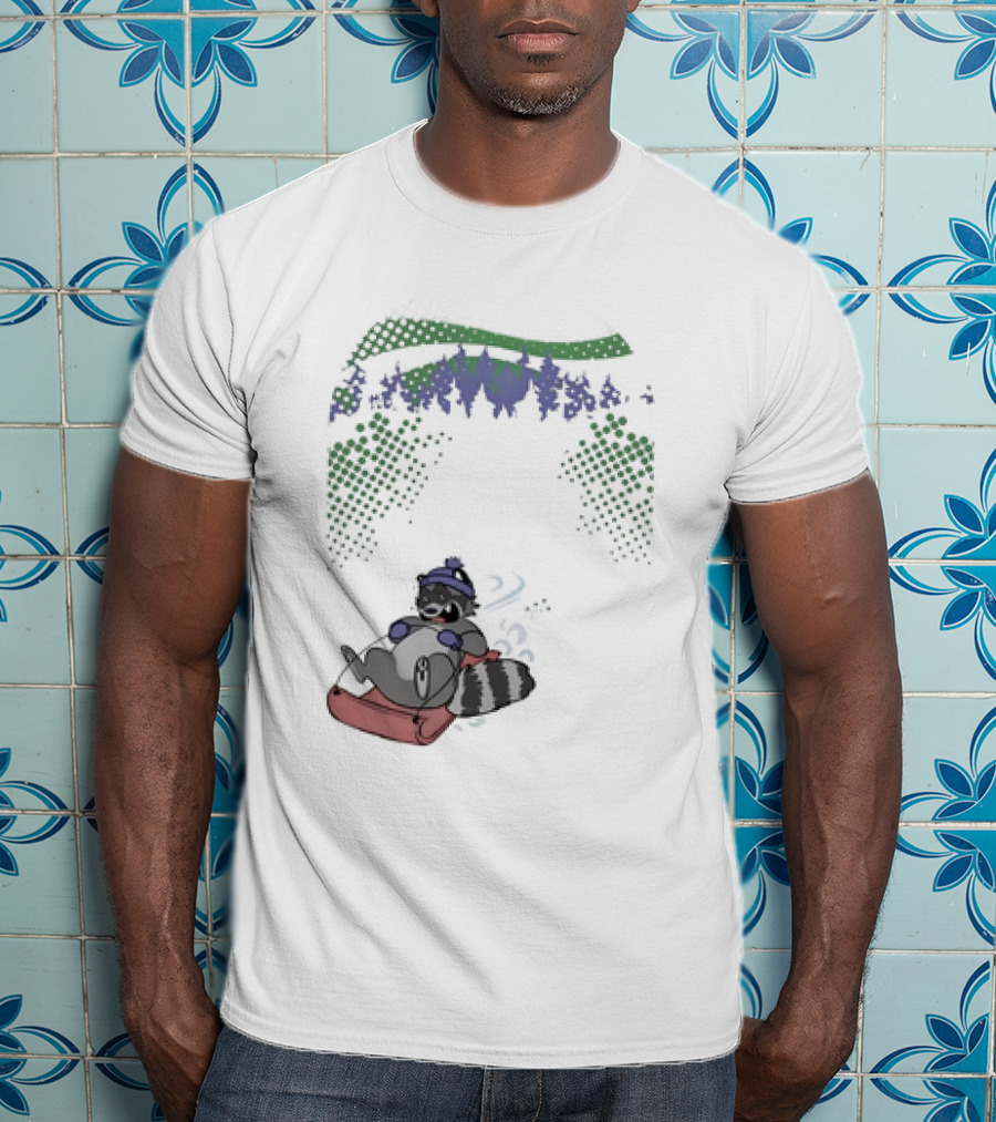 Raccoon Sledding In Winter Forest Scene With Evergreen Trees And Snowflakes T-Shirt