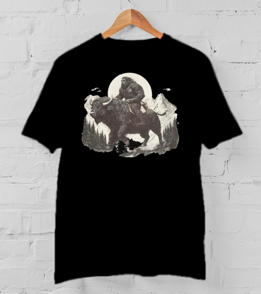 Blurry Creatures Bigfoot Riding Buffalo With Mountains And Moon In Background T-Shirt