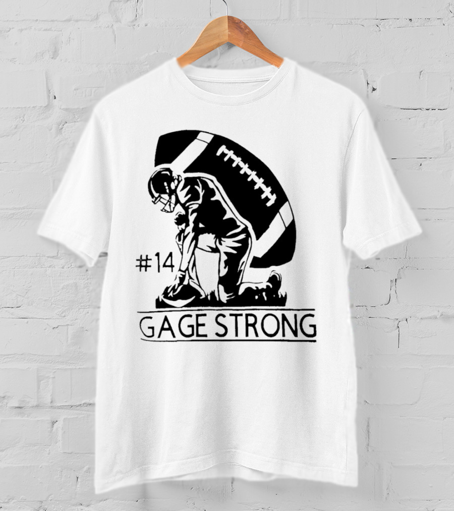 Gage Strong #14 Football Player Kneeling In Front Of Large Football T-Shirt