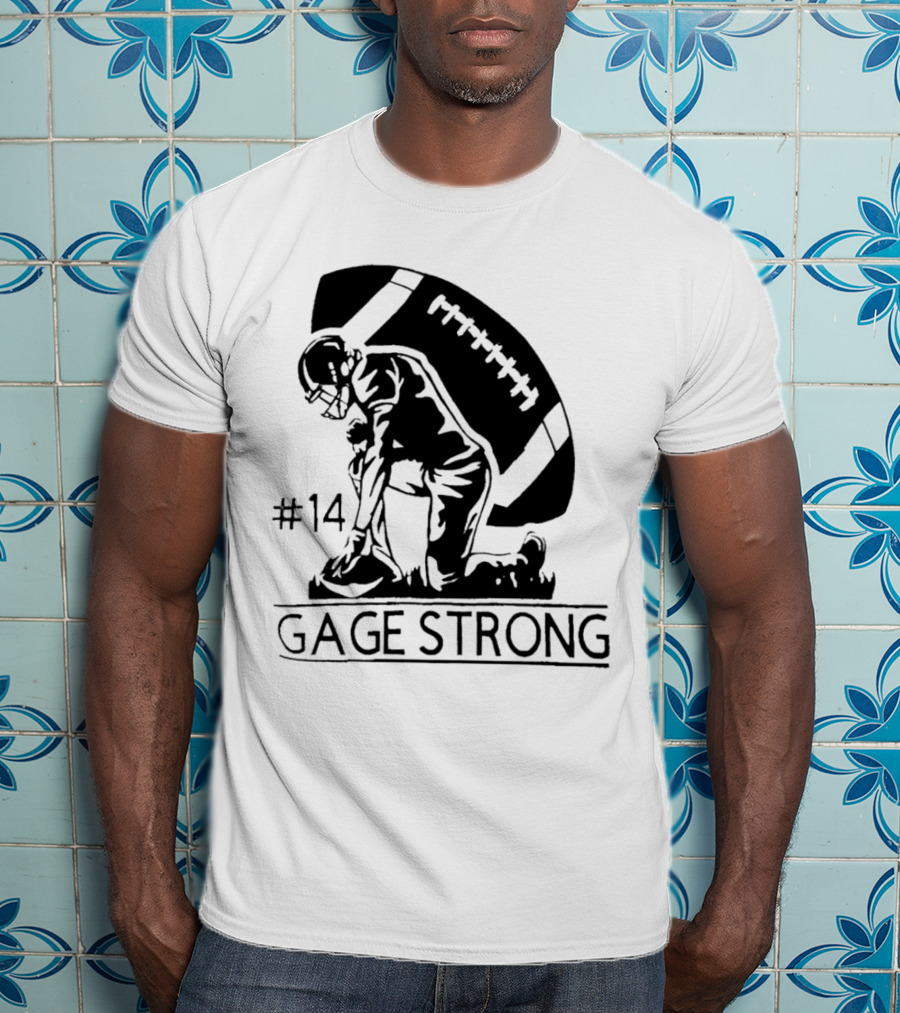 Gage Strong #14 Football Player Kneeling In Front Of Large Football T-Shirt