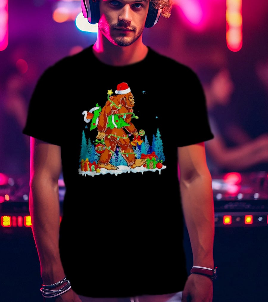 Bigfoot Santa Hugging Christmas Tree With Gifts And Snow Scene T-Shirt