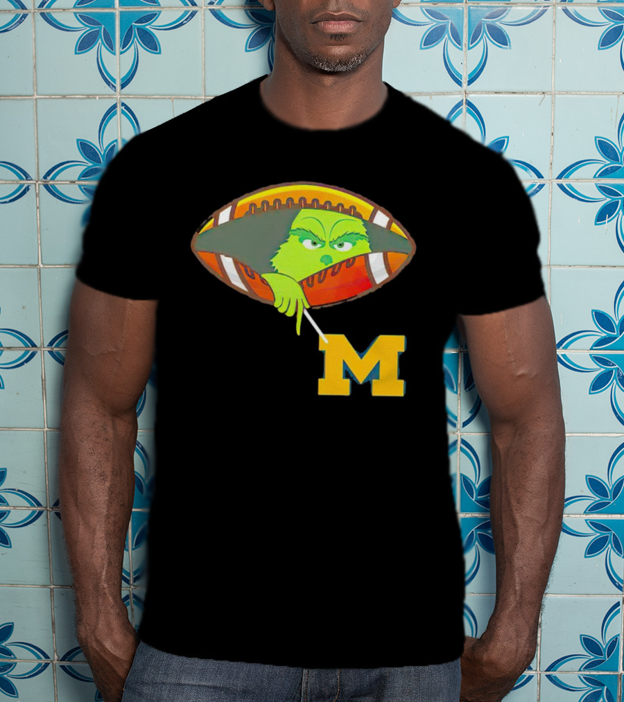 Grinch Peeking From Football Over Michigan Wolverines T-Shirt