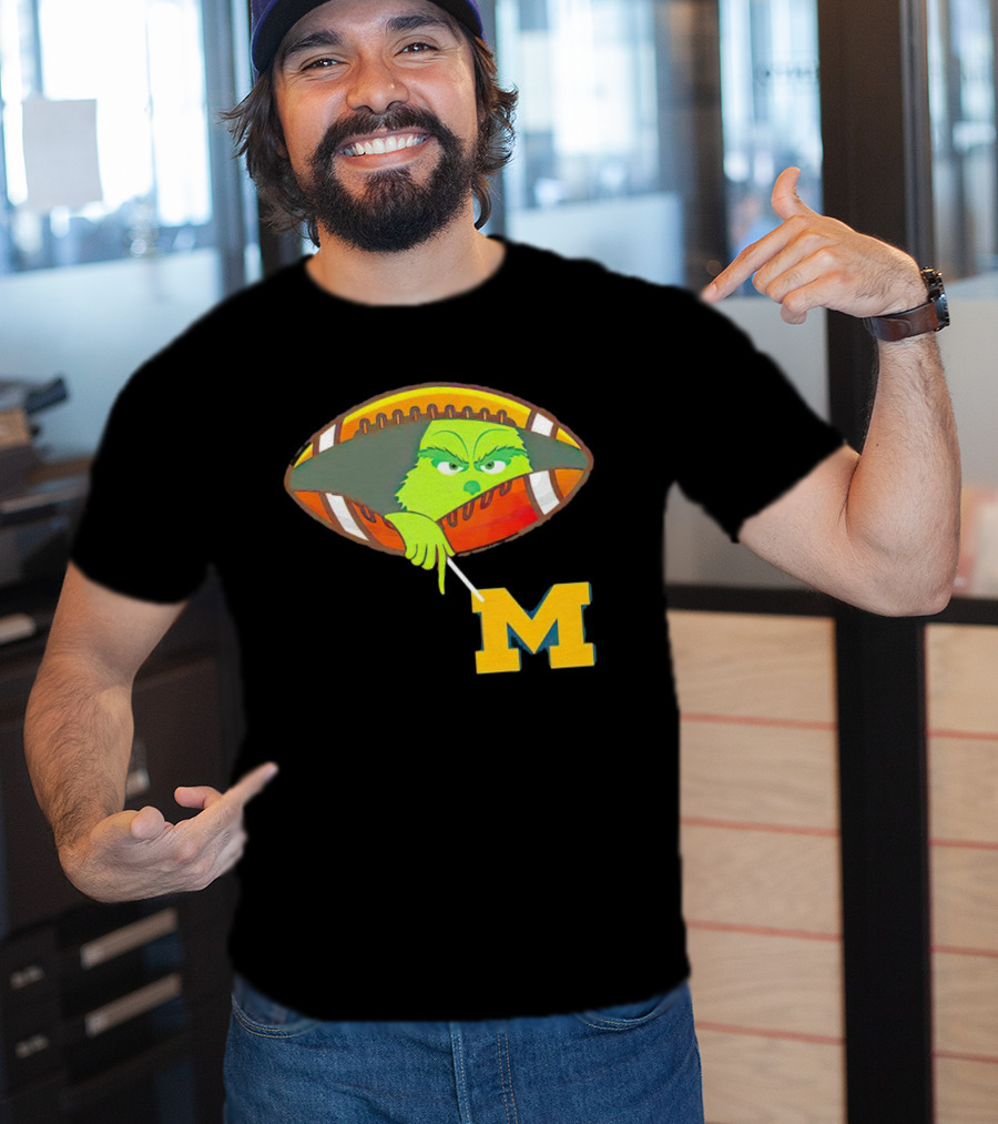 Grinch Peeking From Football Over Michigan Wolverines T-Shirt