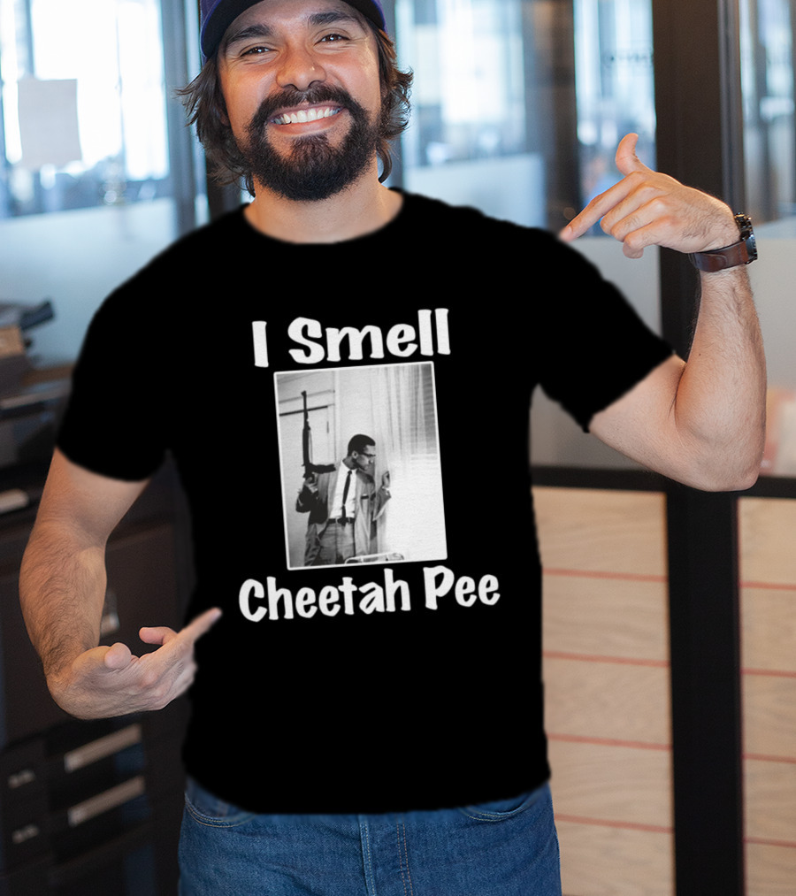 I Smell Cheetah Pee Man Holding Gun By Window T-Shirt