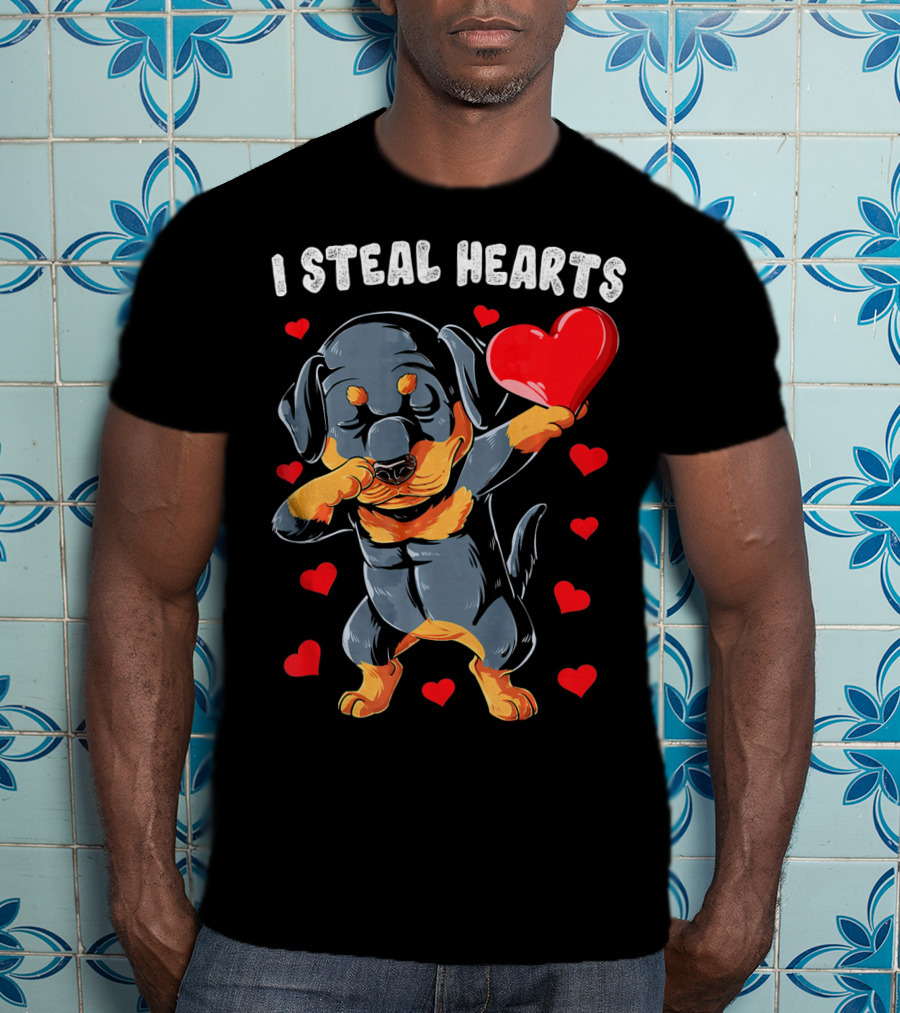 Dabbing Rottweiler Holding Heart Surrounded By I Steal Hearts Text T-Shirt