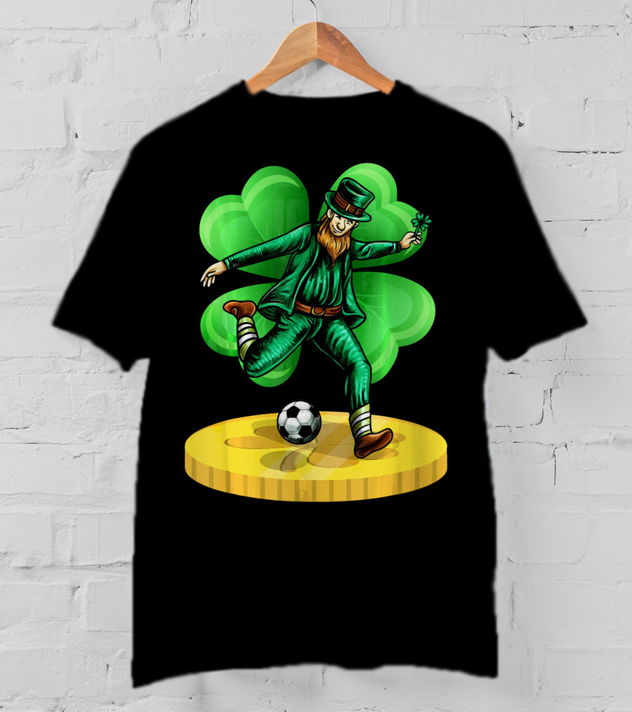 Leprechaun Kicking Soccer Ball On Gold Coin With Shamrock Background T-Shirt