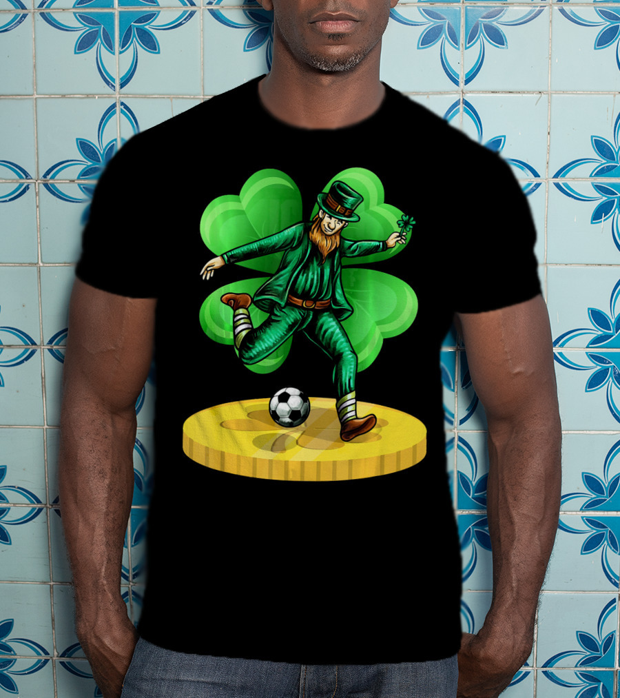 Leprechaun Kicking Soccer Ball On Gold Coin With Shamrock Background T-Shirt