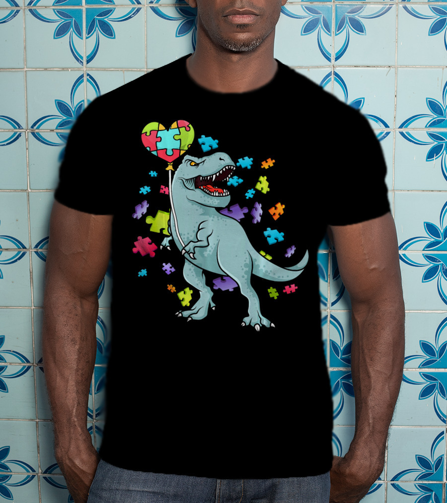 Autism Awareness Dinosaur With Puzzle Heart Balloon And Colorful Puzzle Pieces T-Shirt