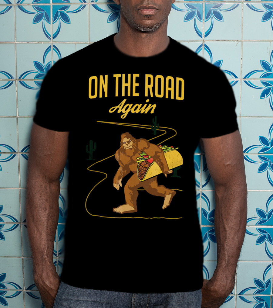 ON THE ROAD AGAIN Smirk Bigfoot Sasquatch Carrying Taco T-Shirt