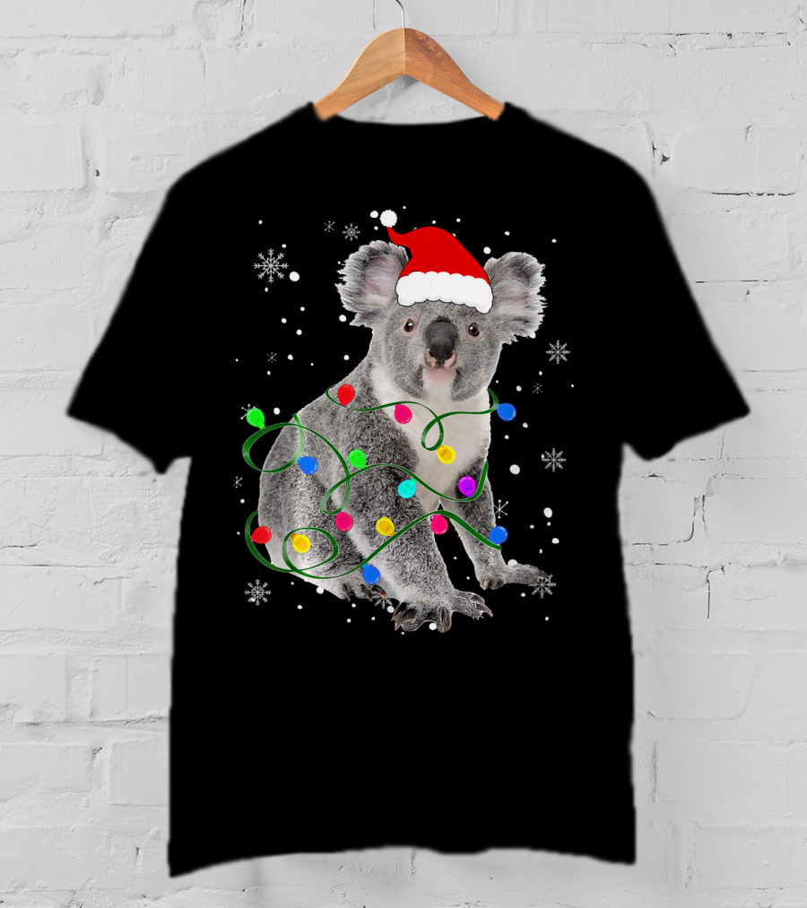 Koala Wrapped In Christmas Lights Wearing Santa Hat With Snowflakes Matching Fam T-Shirt