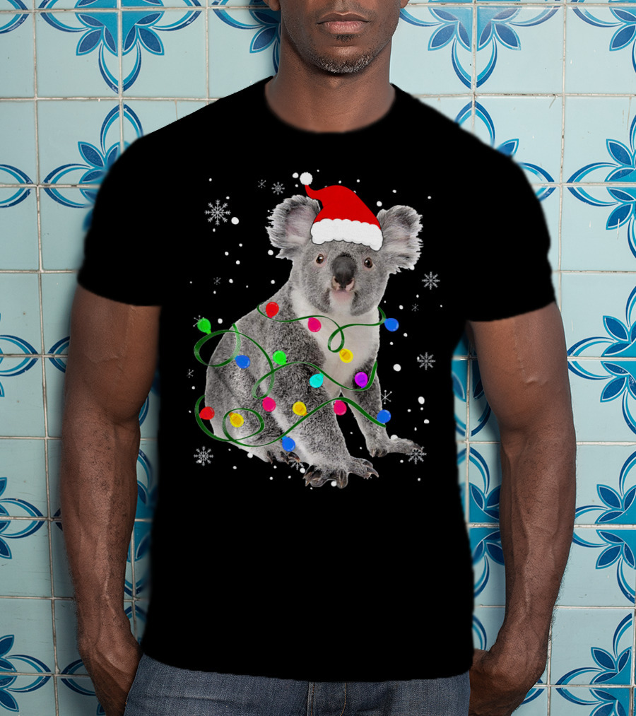 Koala Wrapped In Christmas Lights Wearing Santa Hat With Snowflakes Matching Fam T-Shirt