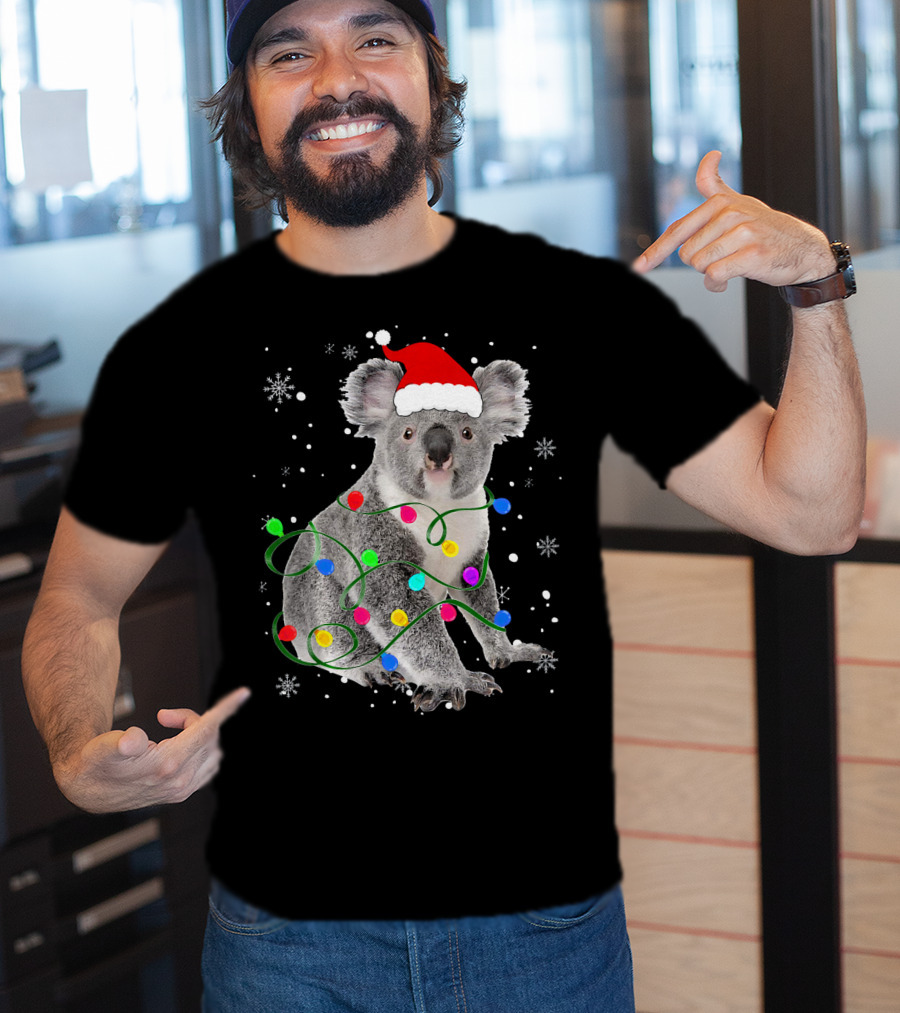 Koala Wrapped In Christmas Lights Wearing Santa Hat With Snowflakes Matching Fam T-Shirt