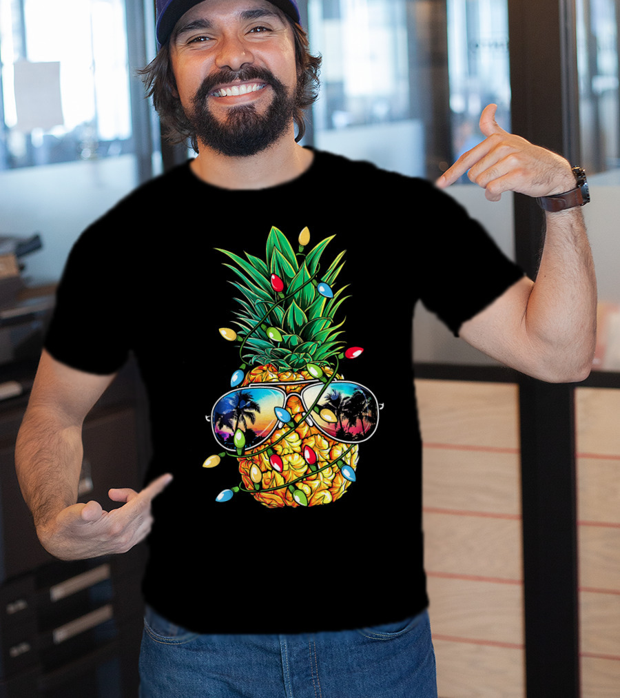 Pineapple Wrapped In Christmas Lights With Sunglasses Reflected Sunset And Palm Trees T-Shirt