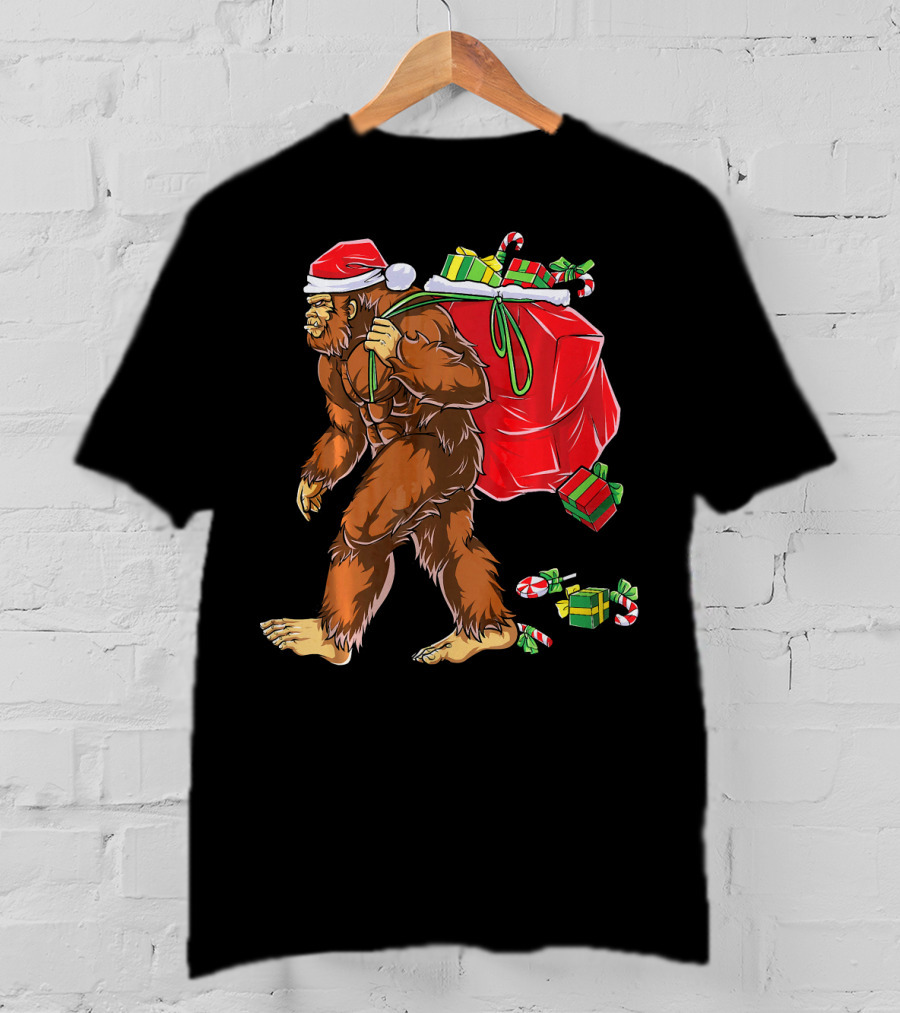 Bigfoot Santa Carrying Gifts With Candy Canes T-Shirt